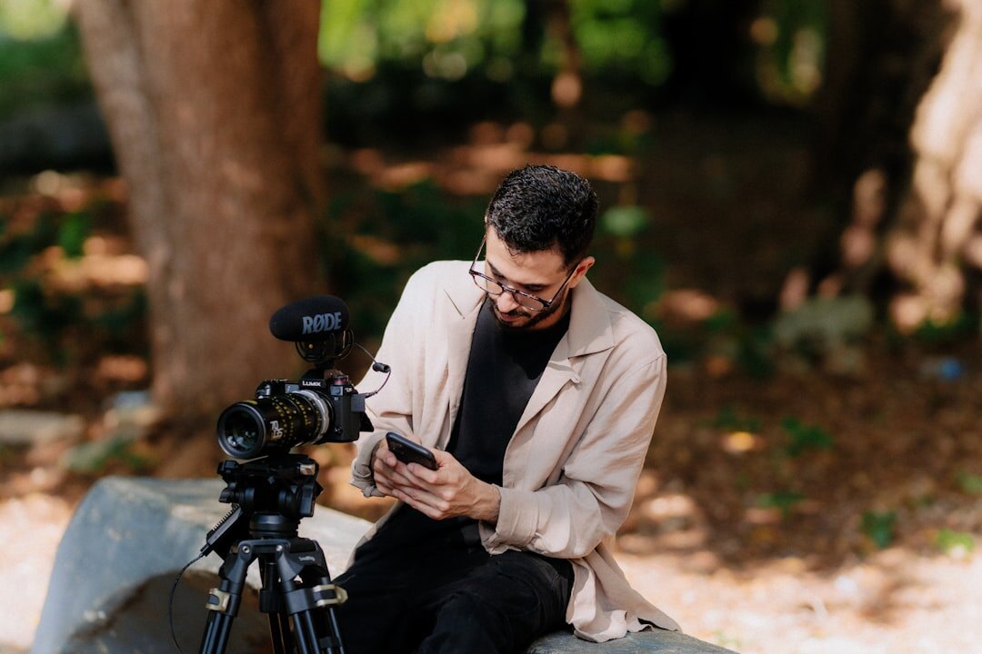 Field reporter filming outdoors with microphone